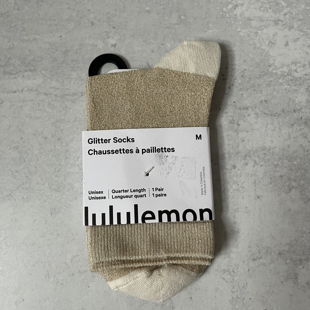 Calcetas Lululemon doradas con glitter talla M